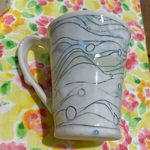 Studio Pottery Mug of blue, green & black lines & circles. Unique handle indent